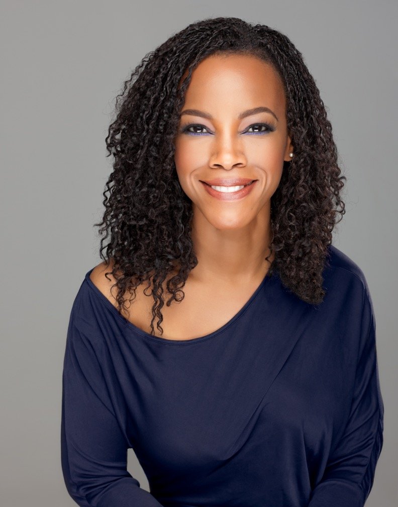 April Yvette Thompson, portrait in a navy top
